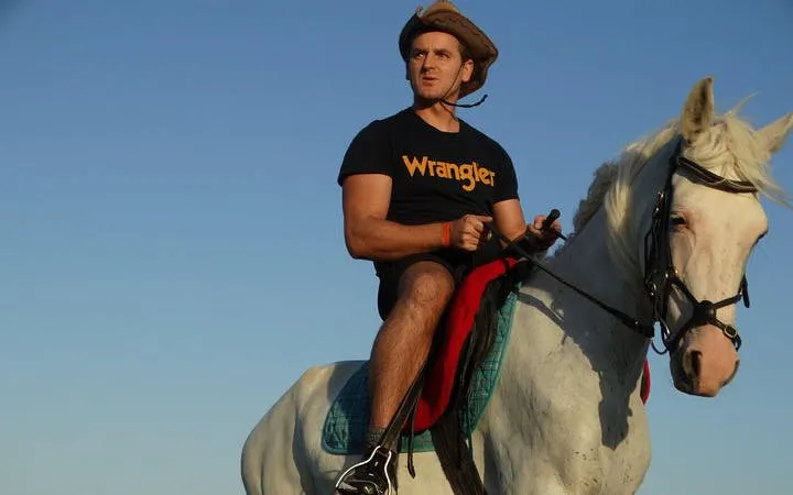 Horseback rider on a white horse at Red Sea beach, Hurghada.