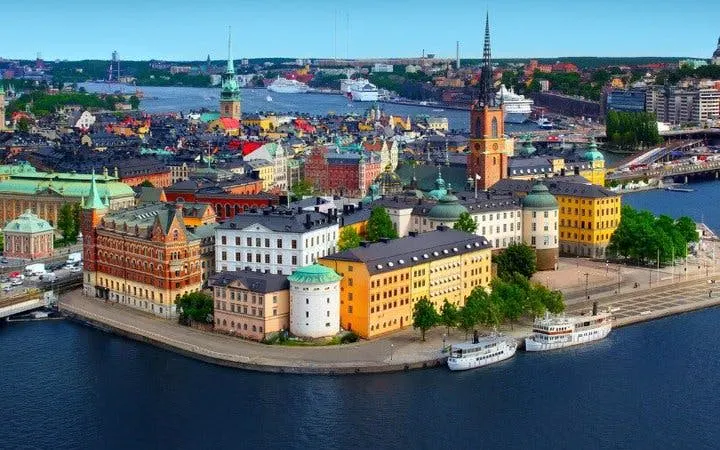 Stockholm cityscape with colorful buildings and waterfront, featured in self-guided walking tour app.