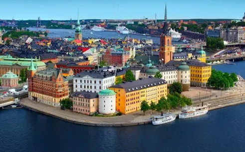 Stockholm cityscape with colorful buildings and waterfront, featured in self-guided walking tour app.