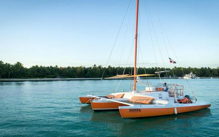 Catamaran anchored in Punta Cana waters, ready for snorkeling tour.