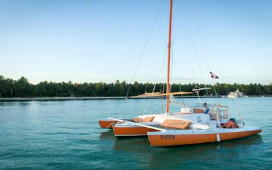 Catamaran anchored in Punta Cana waters, ready for snorkeling tour.