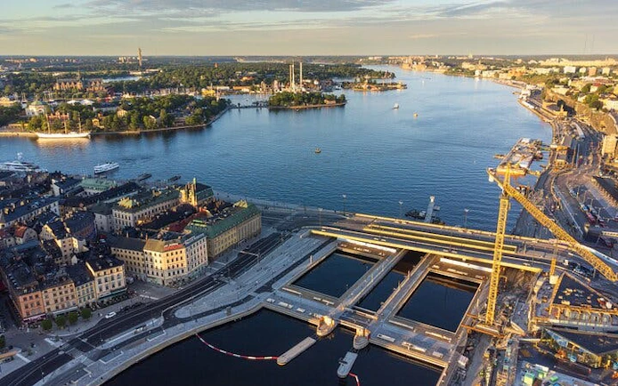 Aerial view of Stockholm waterfront with historic buildings and boats, Sweden.