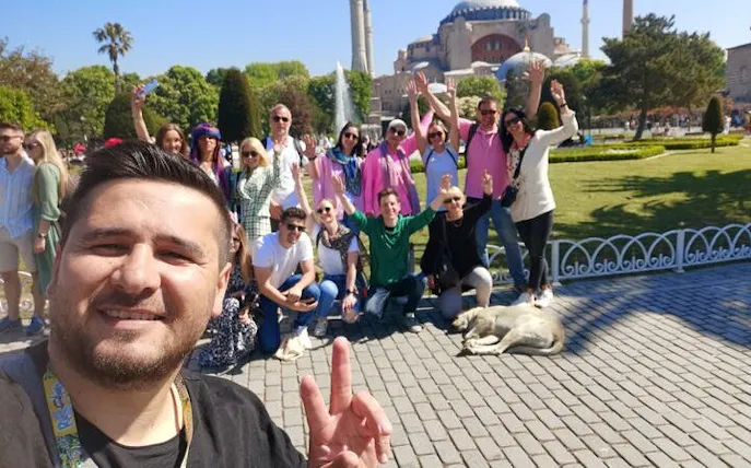 Group of tourists posing in front of Hagia Sophia during Istanbul Old City walking tour.