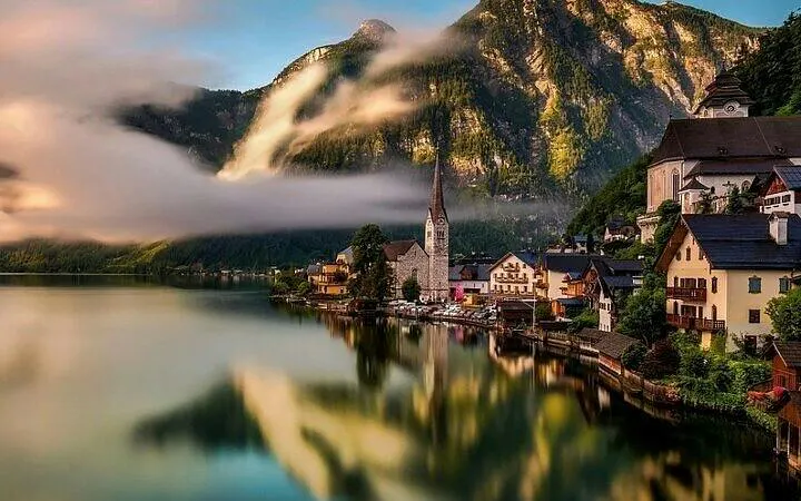 Hallstatt village by the lake with mountains, part of Salzburg to Vienna transfer tour.