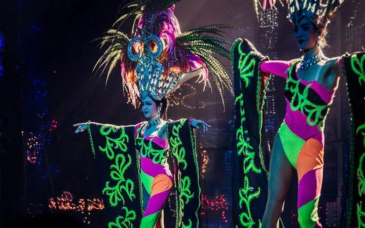Performers in vibrant costumes at Tiffany's Cabaret Show, Pattaya.