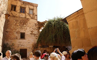 Visitors exploring Saint Catherine Monastery courtyard during guided tour from Sharm El Sheikh.