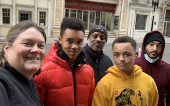 Group exploring Boston's Tremont Temple Baptist Church on a self-guided city game.