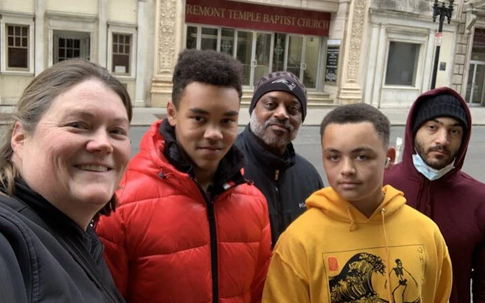 Group exploring Boston's Tremont Temple Baptist Church on a self-guided city game.