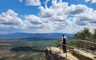 Hiker overlooking vast landscape at Grampians National Park during small-group tour.