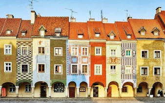 Colorful historic buildings in Poznan's Old Market Square, featured in a self-guided audio tour.