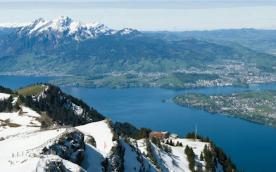 Snow-capped mountains and Lake Lucerne view from Lucerne Old Town walking tour.