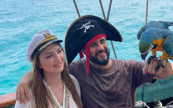 Pirate-themed boat cruise in Antalya with parrot interaction.