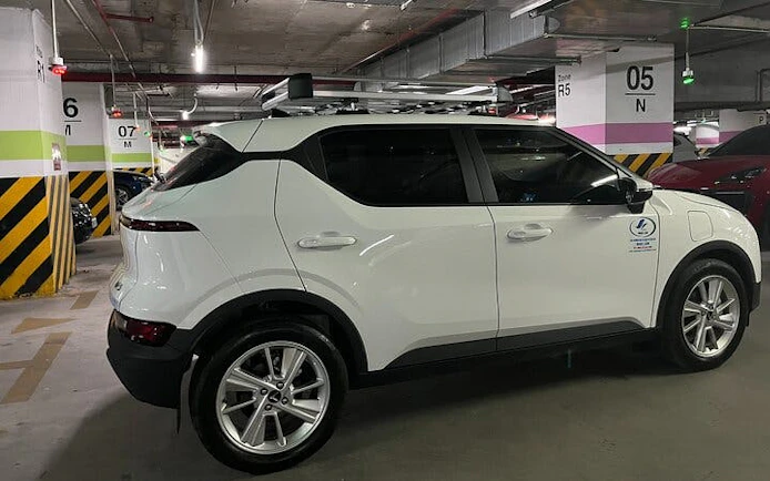 Private car in parking garage for Sapa to Ha Noi transfer service.