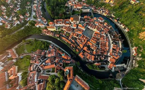 Aerial view of Český Krumlov's historic center with winding river, en route from Prague to Vienna.