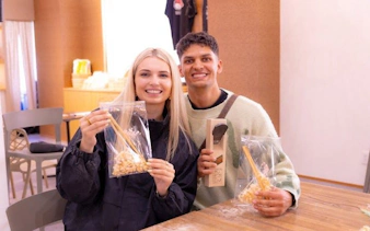 Participants display handmade chopsticks at Osaka workshop near Shinsaibashi and Dotonbori.