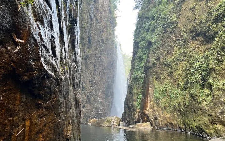 Dragon Waterfall in Sapa with lush cliffs and flowing water.
