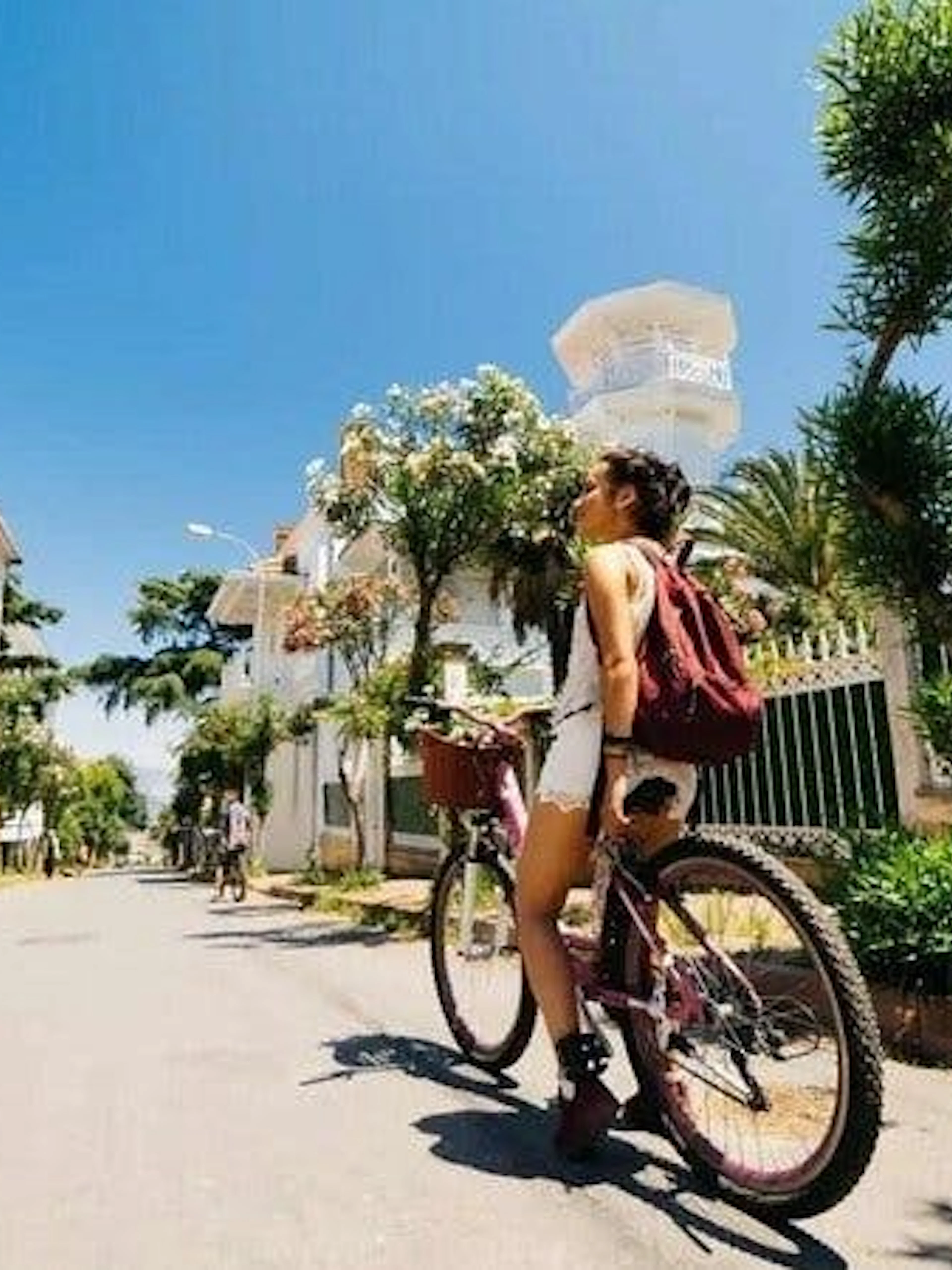 Cyclist exploring Heybeliada street on Princess Islands ferry tour.