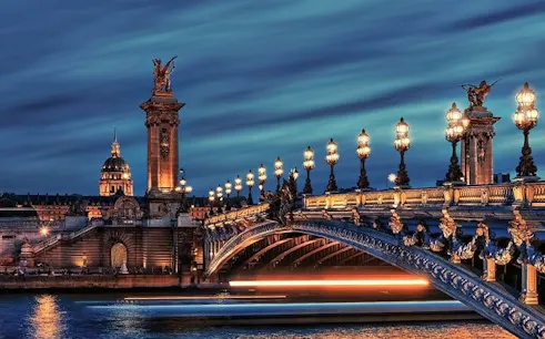 Pont Alexandre III bridge illuminated at night, Paris self-guided walking tour.