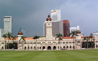 Sultan Abdul Samad Building in Kuala Lumpur with city skyline in the background.