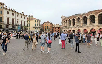 Crowd in front of Arena di Verona, Italy, during a guided city tour.
