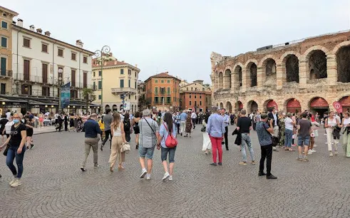 Crowd in front of Arena di Verona, Italy, during a guided city tour.