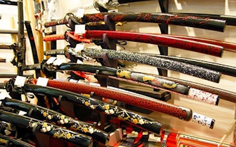 Samurai swords displayed in a specialty shop during Tokyo Asakusa walking tour.