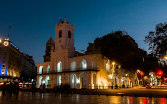 Cabildo at night in Plaza de Mayo, Buenos Aires, part of self-guided audio walking tour.