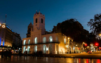 Cabildo at night in Plaza de Mayo, Buenos Aires, part of self-guided audio walking tour.