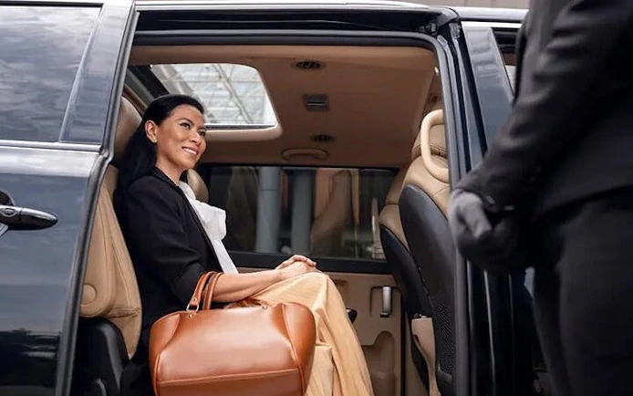 Private transfer service from Taghazout to Marrakesh with passenger in luxury vehicle.