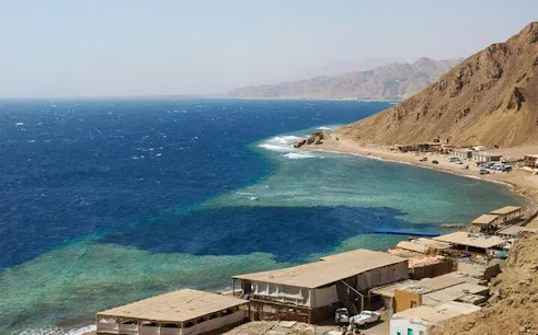 Blue Hole coastline with mountains and buildings, Sharm El Sheikh, Egypt.