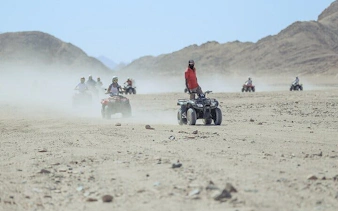 ATV riders exploring desert terrain near Blue Hole Canyon, Sharm El Sheikh.