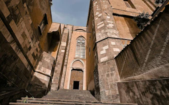 Steps leading to a historic building facade in Naples Historic Center.