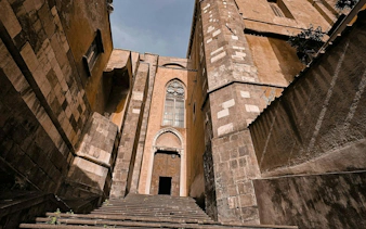 Steps leading to a historic building facade in Naples Historic Center.