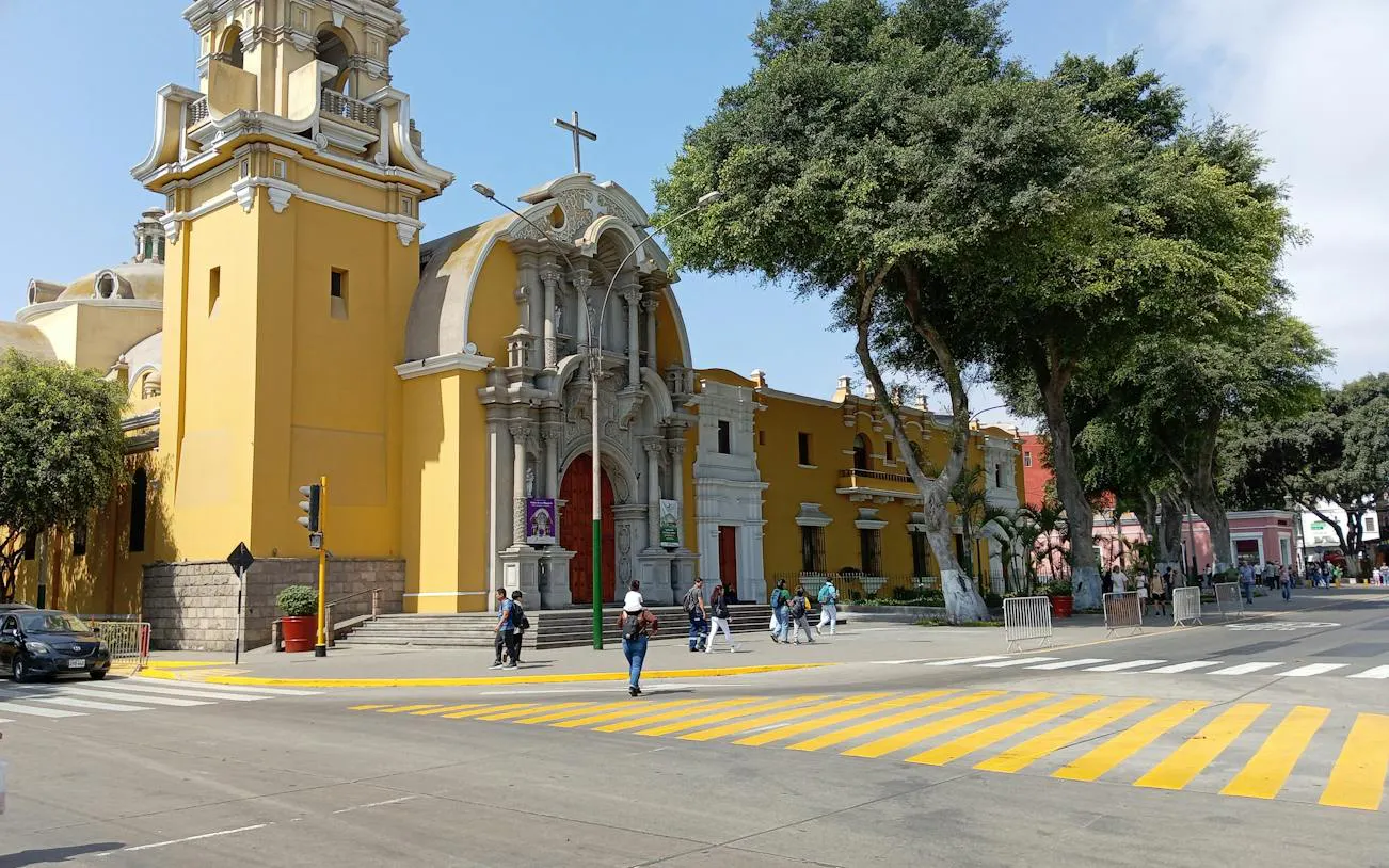 Church facade and street in Barranco district, Lima, part of self-guided audio walking tour.