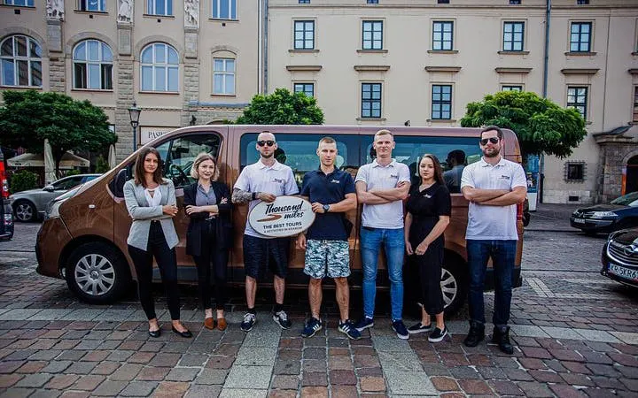Group of people standing in front of a tour van in Krakow for an off-road quad bike tour.