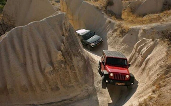 Jeep navigating rocky terrain in Cappadocia during a safari tour.