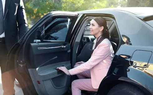 Private car transfer service in Sharm El Sheikh, woman entering vehicle.