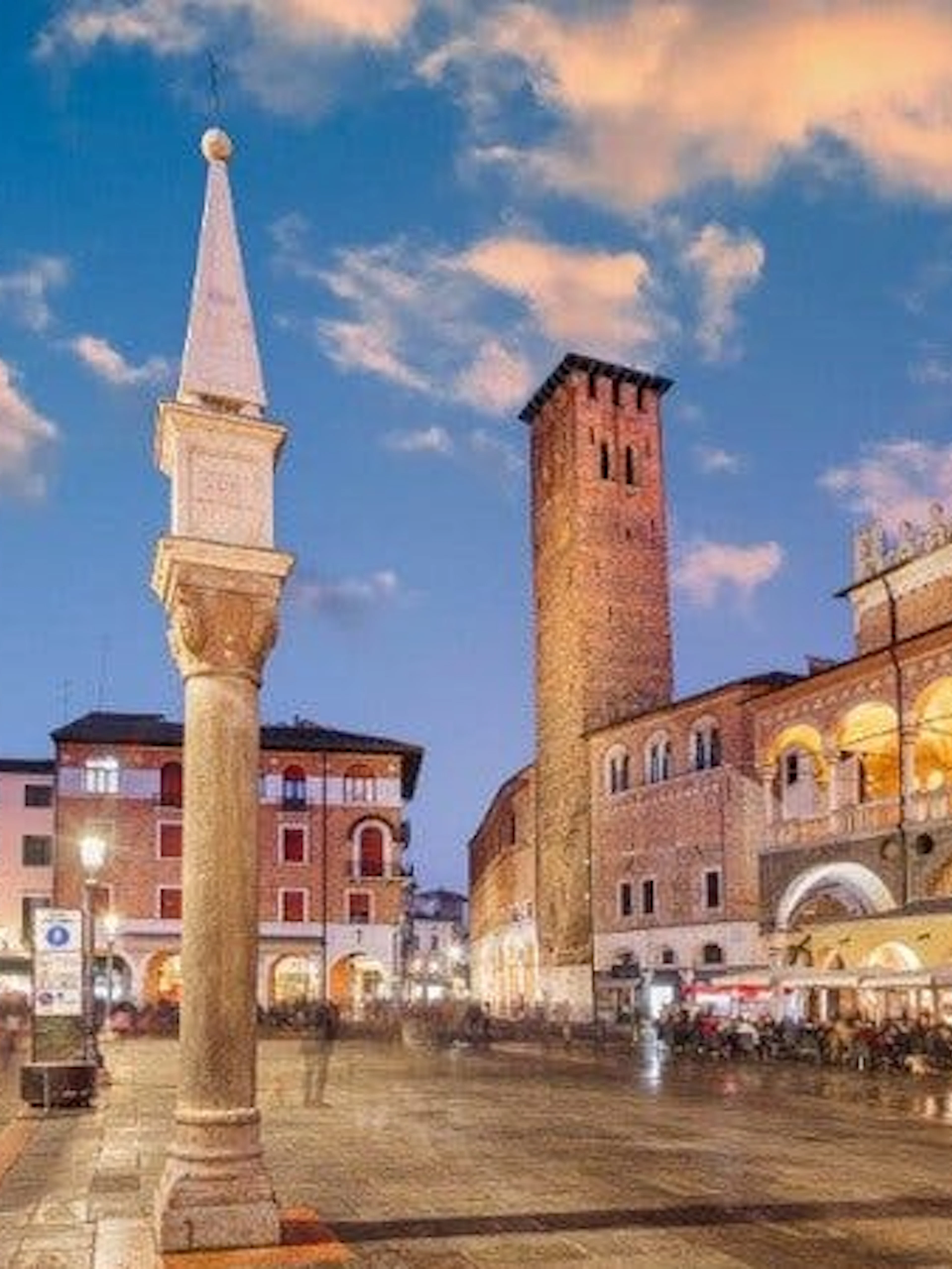 Padua city square with historic buildings and tower during self-guided walking tour.