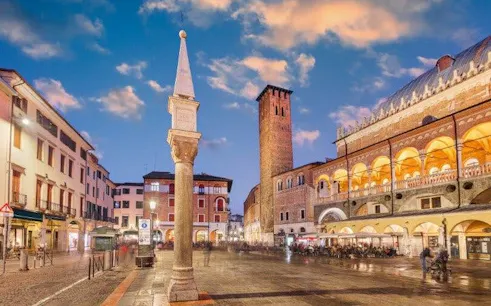 Padua city square with historic buildings and tower during self-guided walking tour.