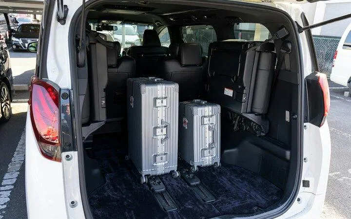 Private transfer vehicle with luggage space for Osaka City to Kansai Airport route.