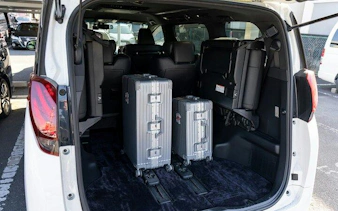 Private transfer vehicle with luggage space for Osaka City to Kansai Airport route.