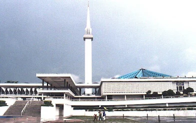 National Mosque of Malaysia with its minaret and blue roof in Kuala Lumpur.