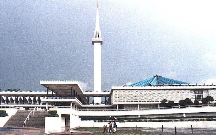 National Mosque of Malaysia with its minaret and blue roof in Kuala Lumpur.