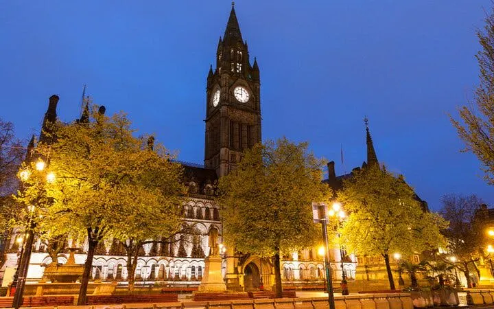 Manchester Town Hall illuminated at night during the Haunted Manchester city exploration game.