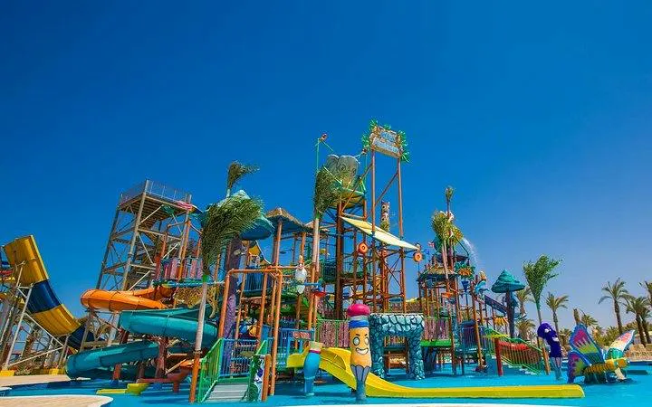 Makadi Water World Aqua Park slides and structures under clear sky, Hurghada.