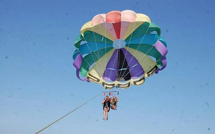 Parasailing over the Red Sea with colorful parachute, Sharm El Sheikh.