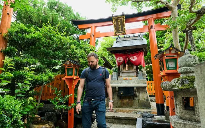 Man exploring a shrine in Kyoto's Gion district during a walking tour.