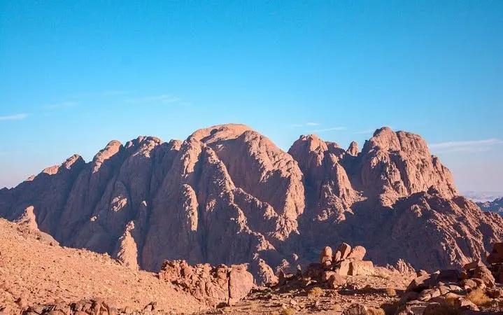 Saint Catherine Monastery tour with Moses Mountain hike, rocky landscape under clear sky.