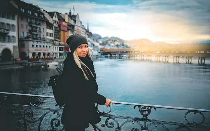 Zurich cityscape with a person on a bridge during a self-guided exploration game.