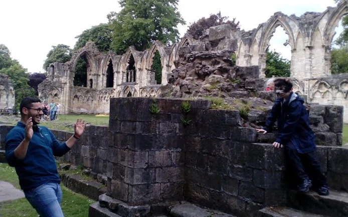 York ruins with people enjoying Harry Potter walking tour activities.